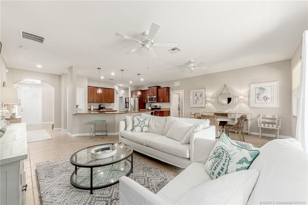 2185 Northwest Dalea Way Stuart, FL 34994 - Photo 11 of 55 a living room with furniture and a view of kitchen