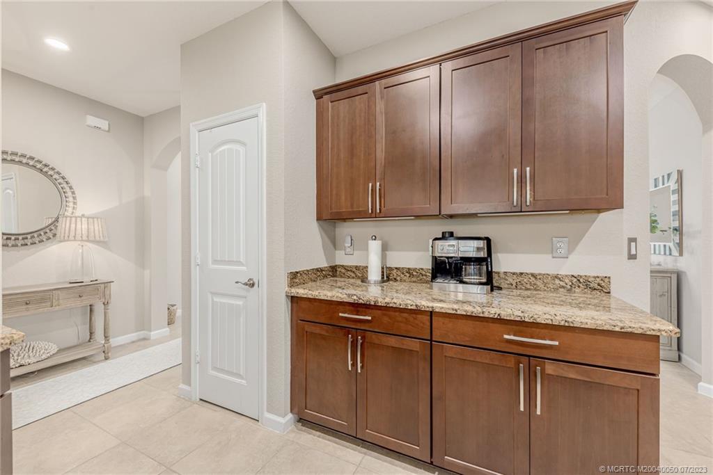 2185 Northwest Dalea Way Stuart, FL 34994 - Photo 17 of 55 a kitchen with a sink and cabinets