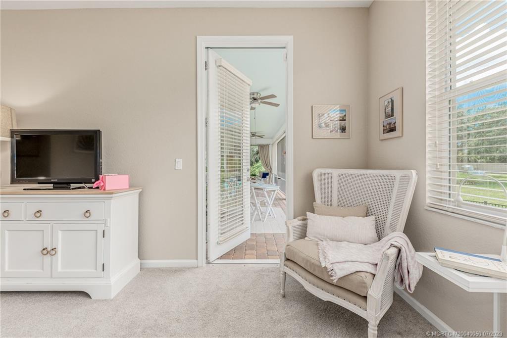 2185 Northwest Dalea Way Stuart, FL 34994 - Photo 19 of 55 a living room with furniture and a flat screen tv