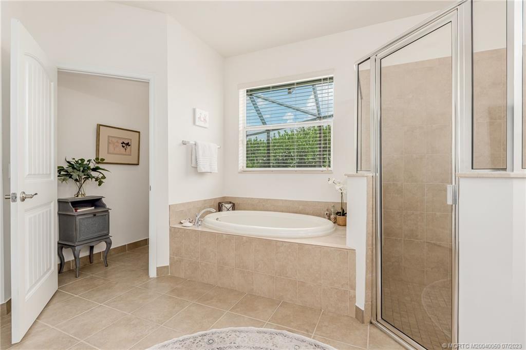 2185 Northwest Dalea Way Stuart, FL 34994 - Photo 22 of 55 a spacious bathroom with a bathtub and a sink