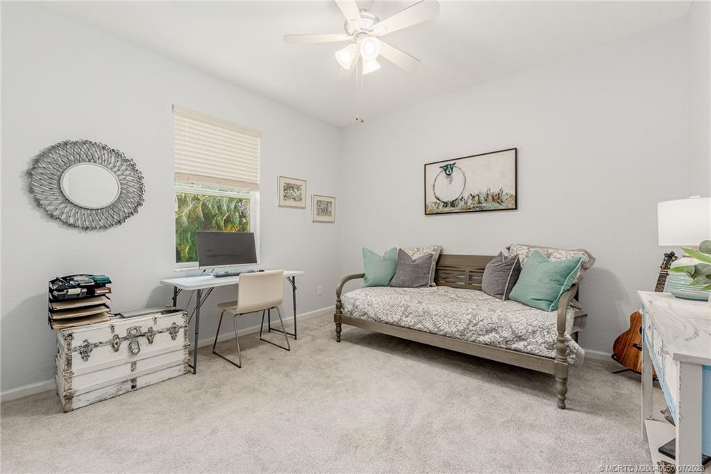 2185 Northwest Dalea Way Stuart, FL 34994 - Photo 24 of 55 a living room with furniture and a window