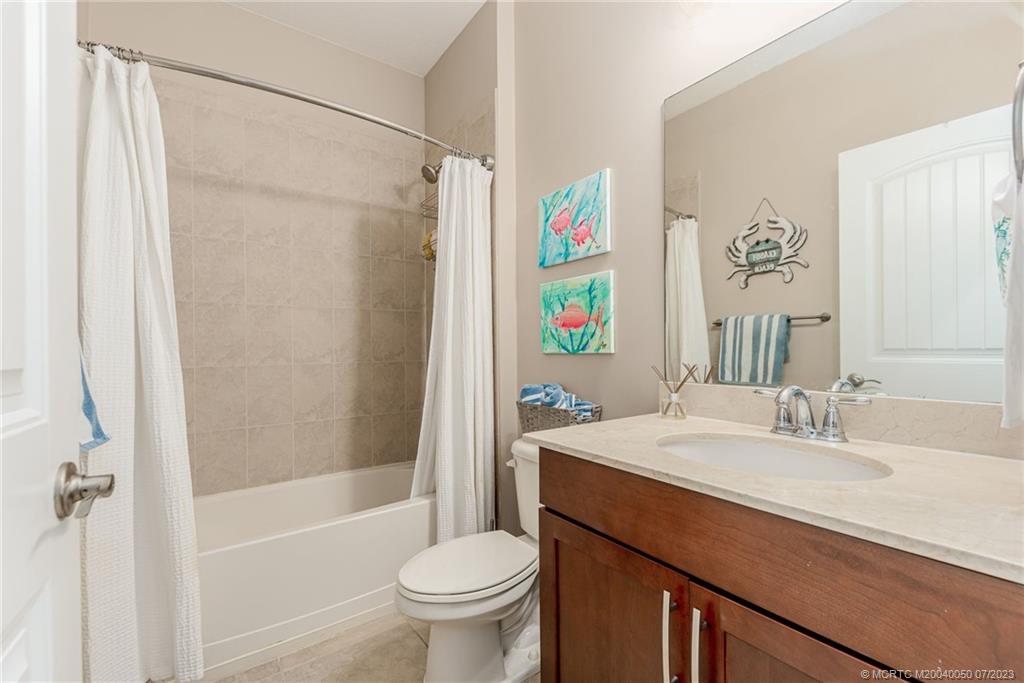 2185 Northwest Dalea Way Stuart, FL 34994 - Photo 25 of 55 a bathroom with a sink toilet and shower