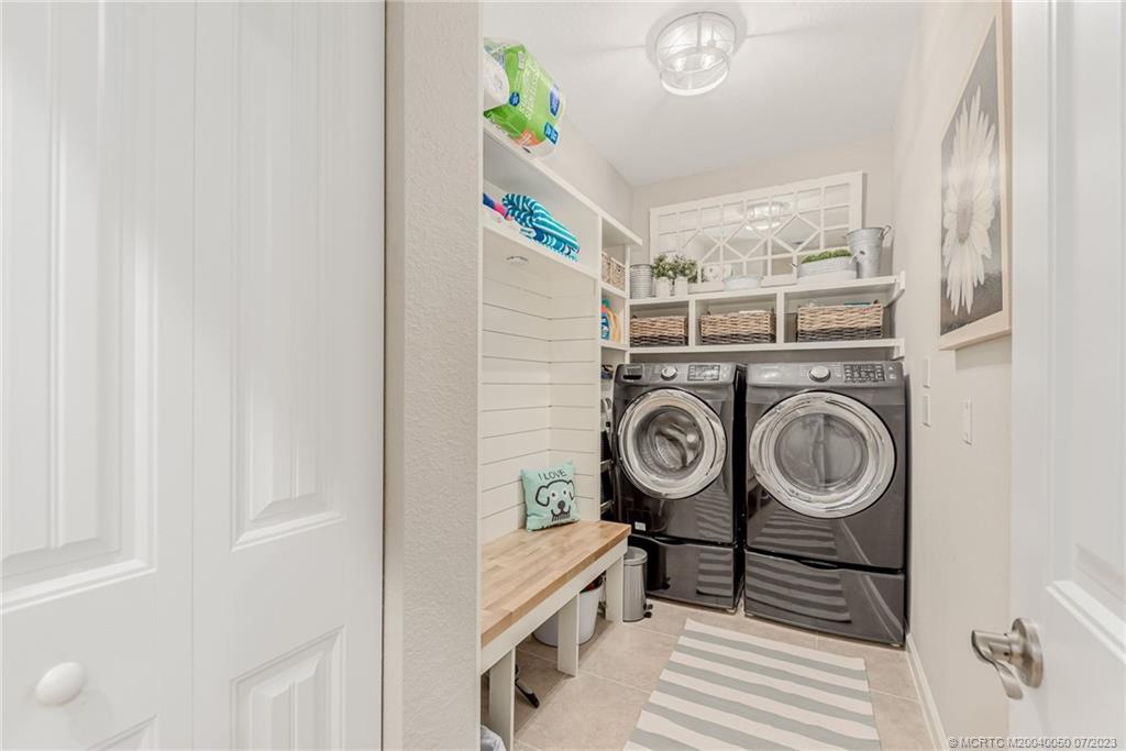 2185 Northwest Dalea Way Stuart, FL 34994 - Photo 26 of 55 a utility room with dryer and washer