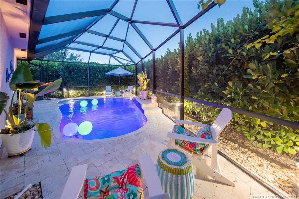 2185 Northwest Dalea Way Stuart, FL 34994 - Photo 32 of 55 a view of a chairs and table in the patio