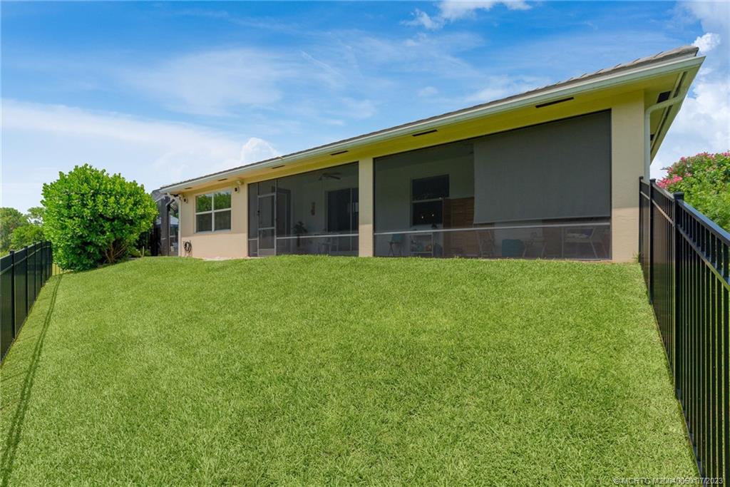 2185 Northwest Dalea Way Stuart, FL 34994 - Photo 37 of 55 a view of house with backyard and garden
