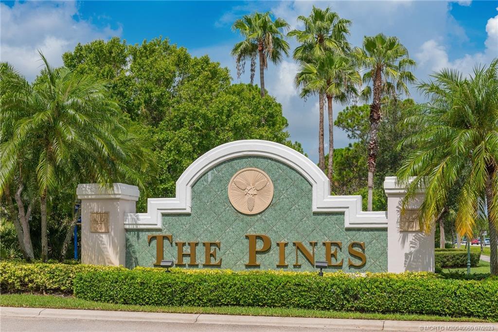 2185 Northwest Dalea Way Stuart, FL 34994 - Photo 39 of 55 a front view of a house with garden