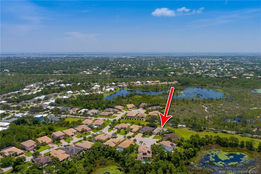 2185 Northwest Dalea Way Stuart, FL 34994 - Photo 40 of 55 an aerial view of a houses with a yard