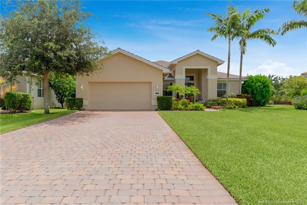 2185 Northwest Dalea Way Stuart, FL 34994 - Photo 4 of 55 a front view of house with yard and green space