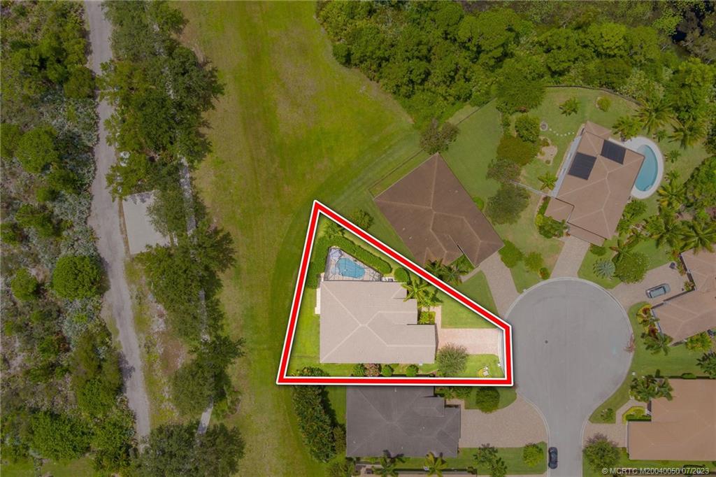 2185 Northwest Dalea Way Stuart, FL 34994 - Photo 45 of 55 an aerial view of a house with pool yard and outdoor seating