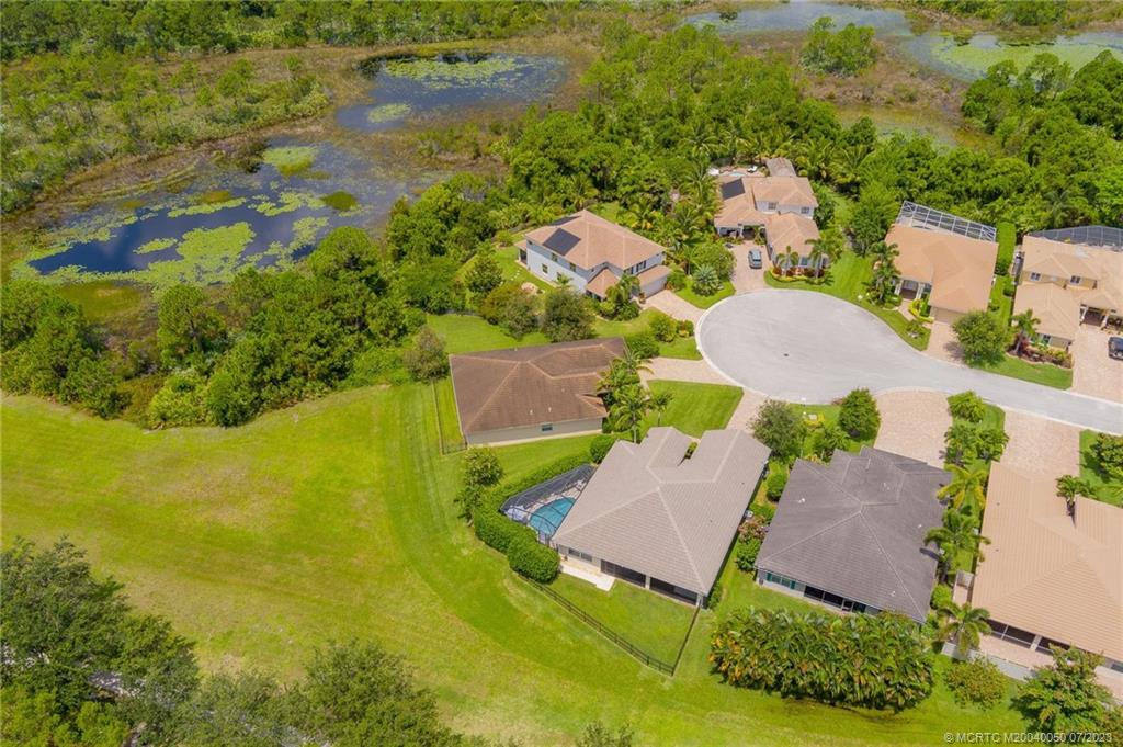 2185 Northwest Dalea Way Stuart, FL 34994 - Photo 48 of 55 an aerial view of a house with a yard