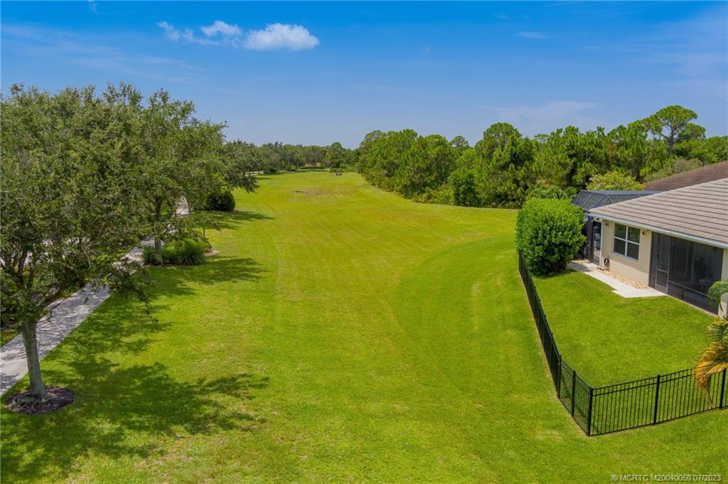2185 Northwest Dalea Way Stuart, FL 34994 - Photo 52 of 55 a view of a swimming pool with a garden