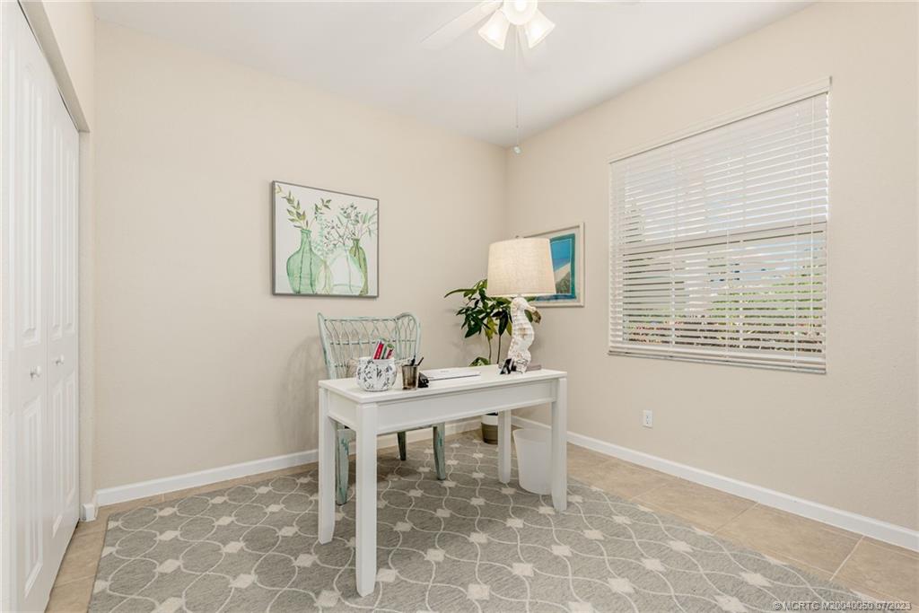 2185 Northwest Dalea Way Stuart, FL 34994 - Photo 8 of 55 a workspace with furniture and window