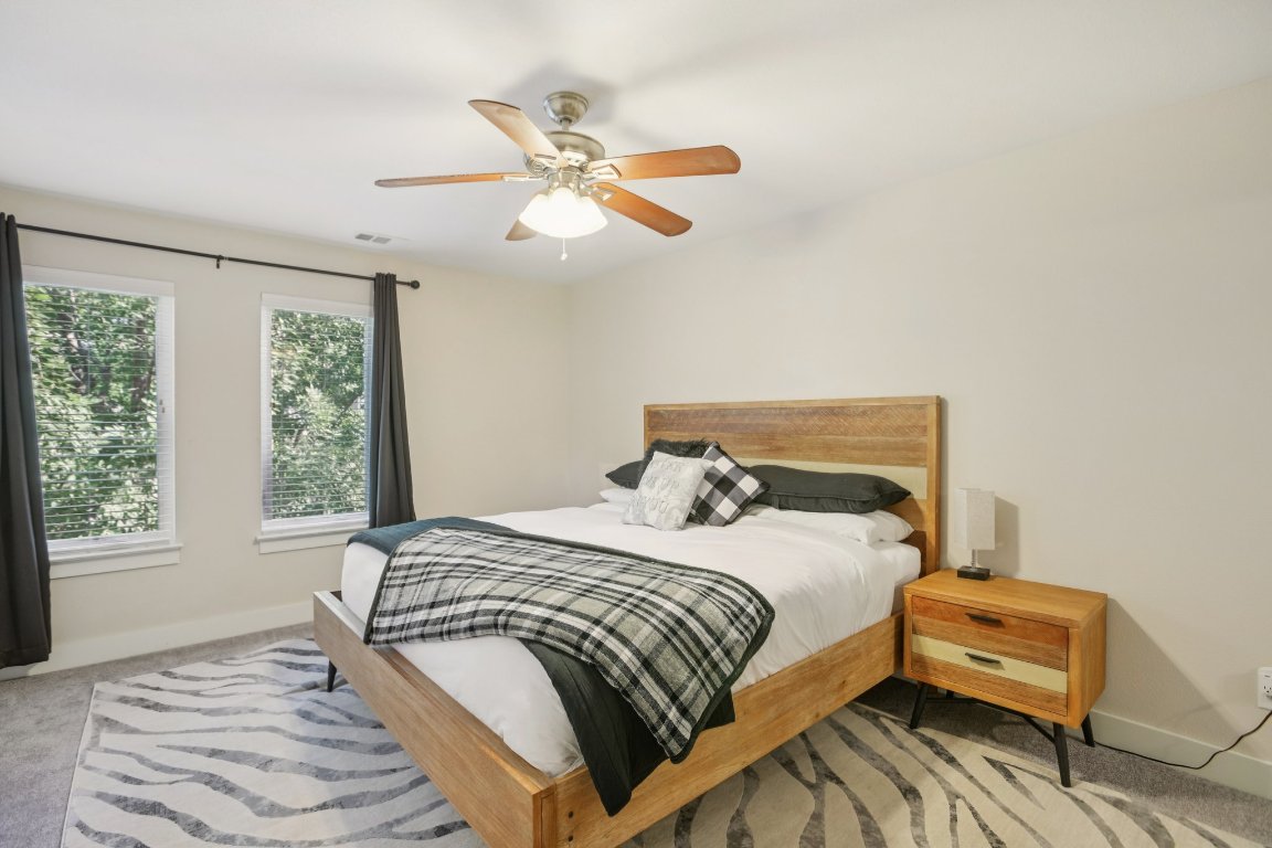1206 Deloney Street, Unit B Austin, TX 78721 - Photo 21 of 39 Bedroom featuring carpet floors and a ceiling fan
