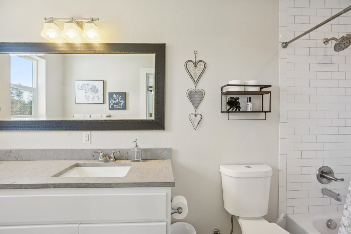 1206 Deloney Street, Unit B Austin, TX 78721 - Photo 28 of 39 Full bathroom featuring shower / washtub combination and vanity