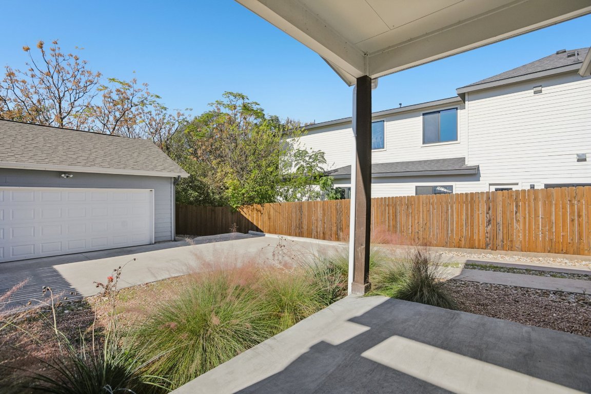 1206 Deloney Street, Unit B Austin, TX 78721 - Photo 33 of 39 View of patio featuring a garage