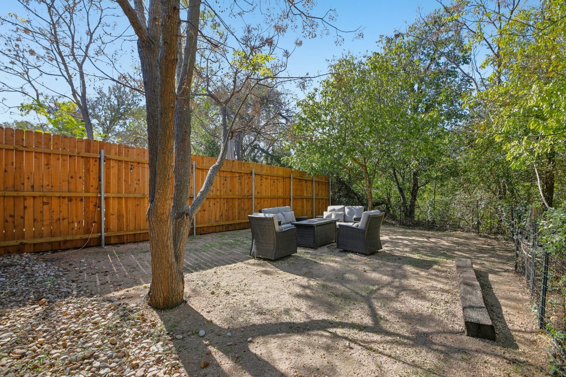 1206 Deloney Street, Unit B Austin, TX 78721 - Photo 4 of 39 Fenced backyard with an outdoor hangout area and a patio area