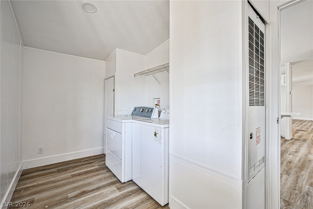 273 Aztec Lane Henderson, NV 89015 - Photo 25 of 28 Functional laundry room equipped with washer and dryer, simplifying household chores.
