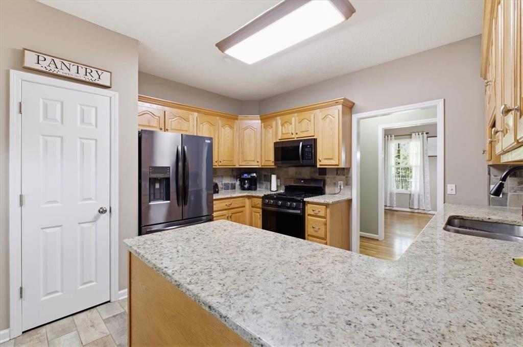 164 Laurens Road Rockmart, GA 30153 - Photo 16 of 41 a kitchen with stainless steel appliances granite countertop a refrigerator stove and oven