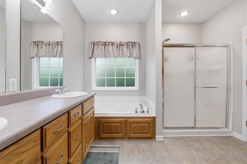 164 Laurens Road Rockmart, GA 30153 - Photo 19 of 41 a bathroom with a tub sink and mirror