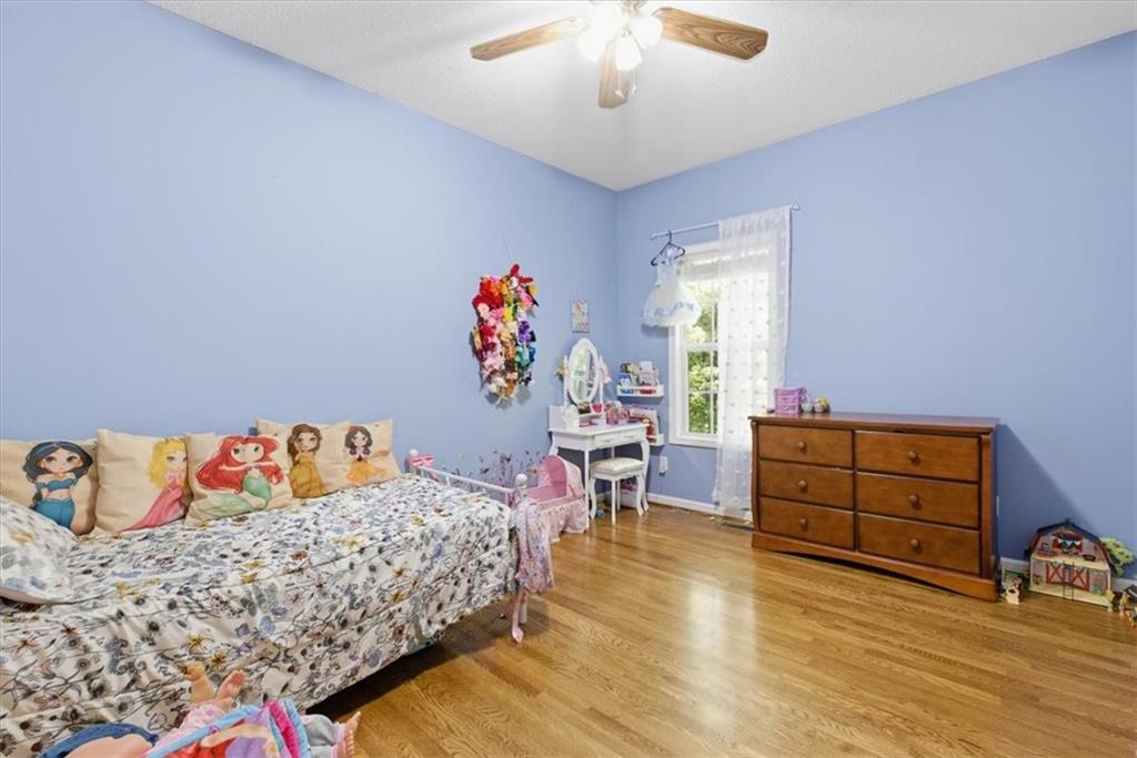 164 Laurens Road Rockmart, GA 30153 - Photo 24 of 41 a bedroom with a bed and a dresser