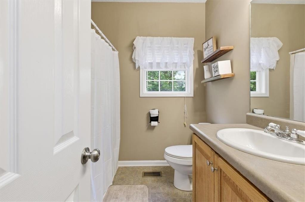164 Laurens Road Rockmart, GA 30153 - Photo 25 of 41 a bathroom with a sink toilet and shower