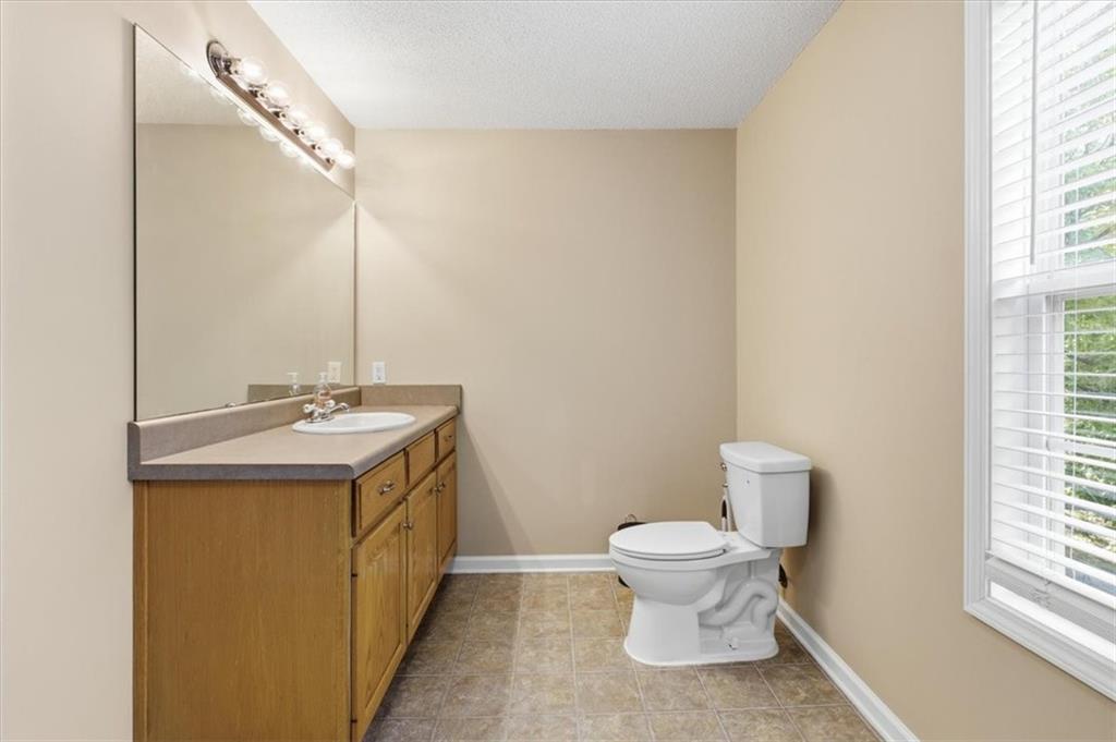 164 Laurens Road Rockmart, GA 30153 - Photo 30 of 41 a bathroom with a toilet sink and mirror