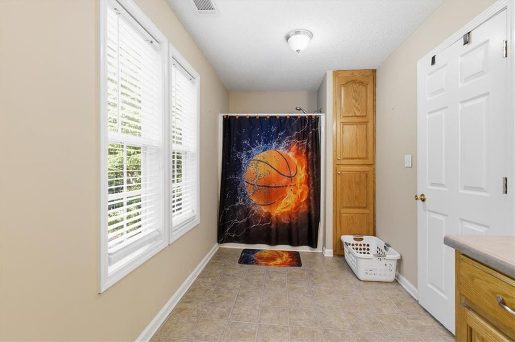 164 Laurens Road Rockmart, GA 30153 - Photo 31 of 41 a room with toys and a window with garden view