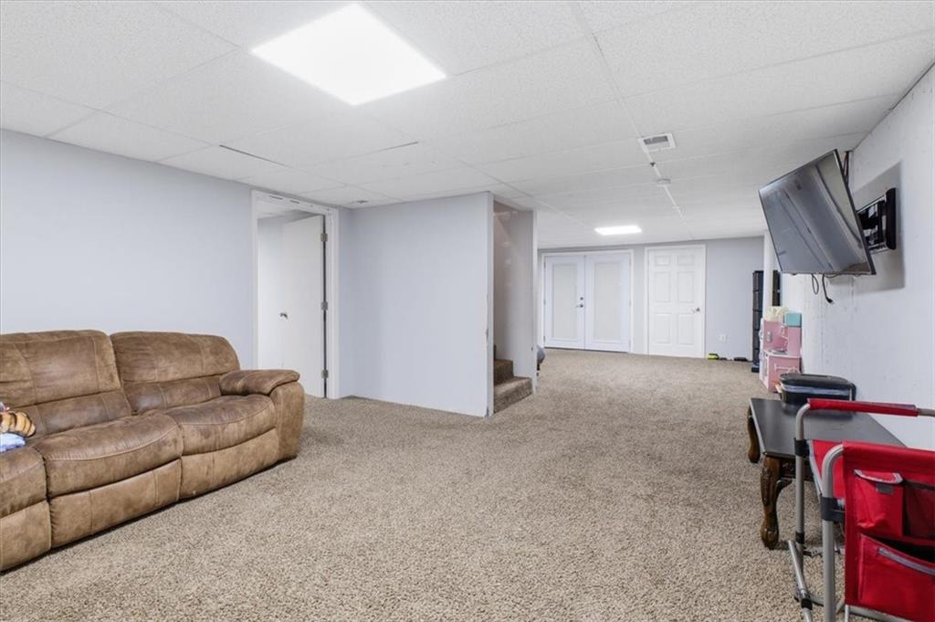 164 Laurens Road Rockmart, GA 30153 - Photo 33 of 41 a living room with furniture and a flat screen tv