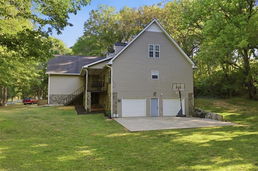 164 Laurens Road Rockmart, GA 30153 - Photo 6 of 41 a view of a backyard with a garden and entertaining space