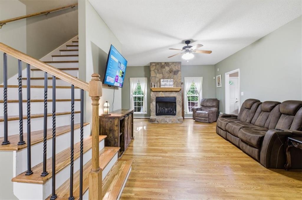 164 Laurens Road Rockmart, GA 30153 - Photo 8 of 41 a living room with furniture and a fireplace