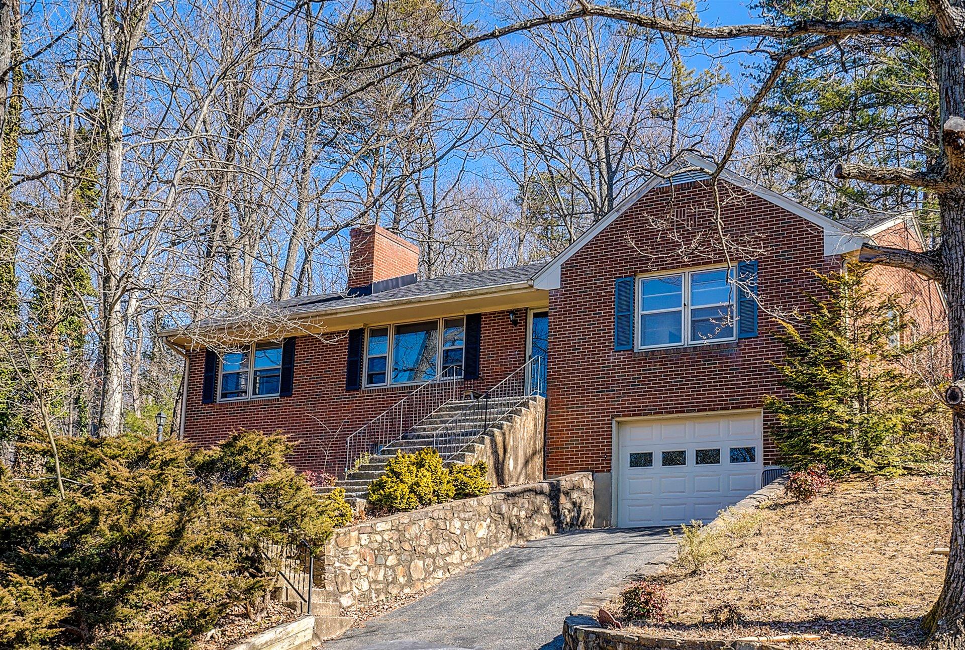3026 Sedgefield Road Southwest Roanoke, VA 24018 - Photo 1 of 25 a front view of a house with a yard