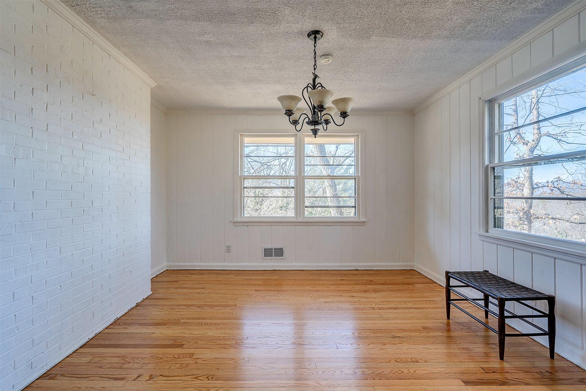 3026 Sedgefield Road Southwest Roanoke, VA 24018 - Photo 3 of 25 a view of empty room with wooden floor and fan