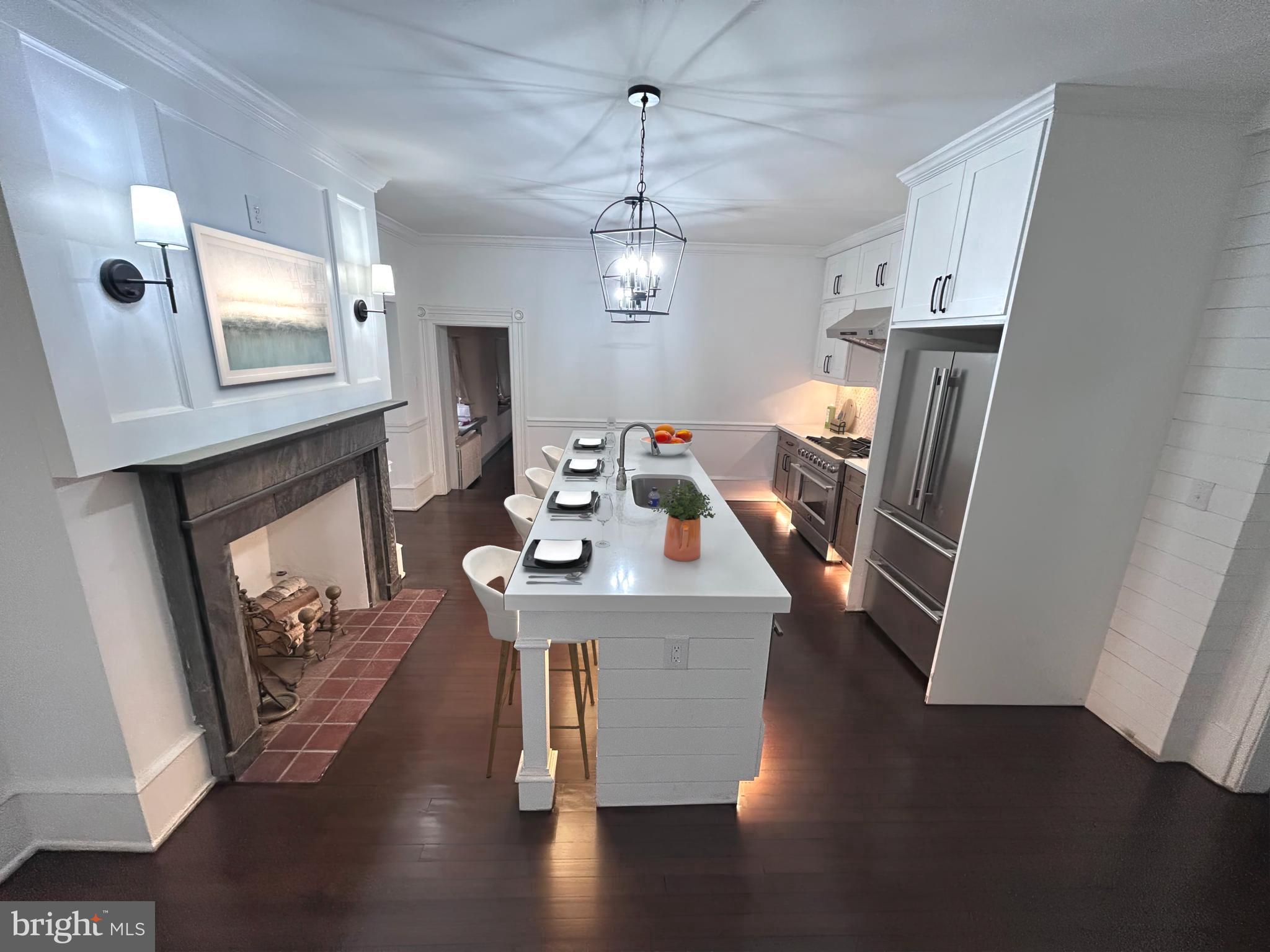571 North Newtown Street Road Newtown Square, PA 19073 - Photo 2 of 25 a view of a dining room with furniture wooden floor fireplace and a chandelier