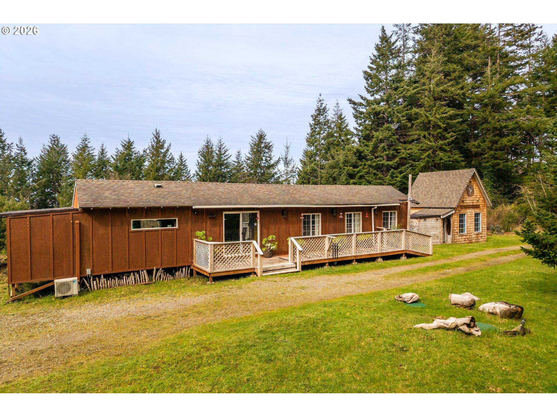 42365 Hensley Hill Road Port Orford, OR 97465 - Photo 15 of 47 a view of a house with a yard and sitting area