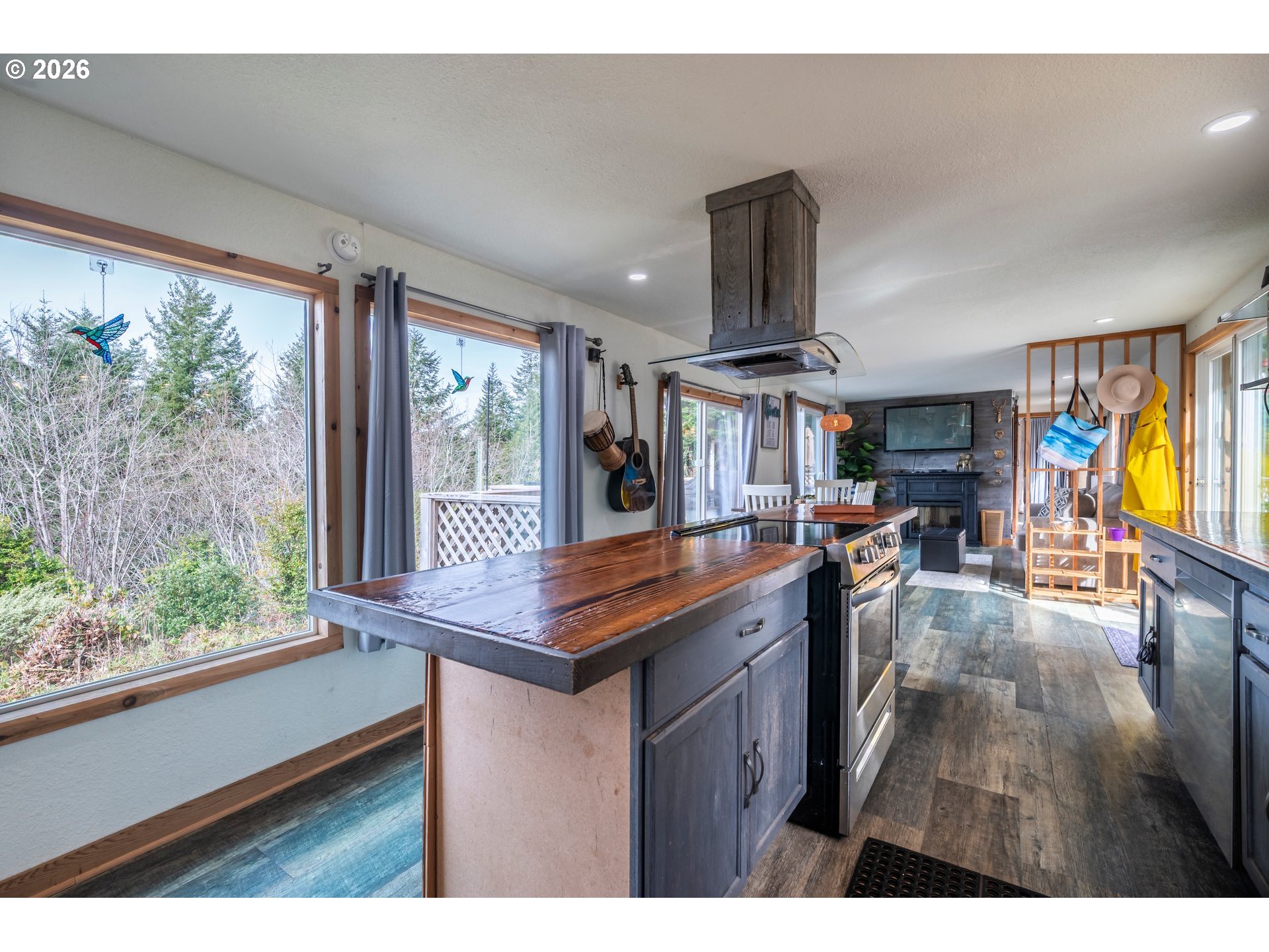 42365 Hensley Hill Road Port Orford, OR 97465 - Photo 16 of 47 a kitchen with stainless steel appliances granite countertop a stove and a large window