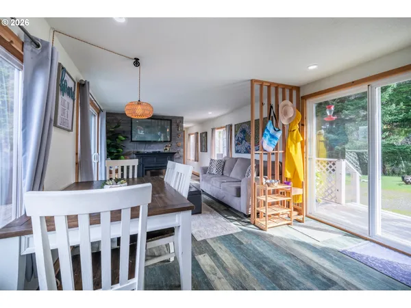 a view of living room kitchen and dining room