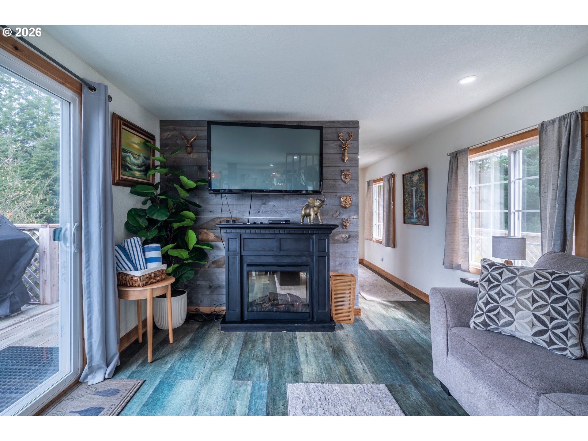 42365 Hensley Hill Road Port Orford, OR 97465 - Photo 24 of 47 a living room with furniture and a fireplace