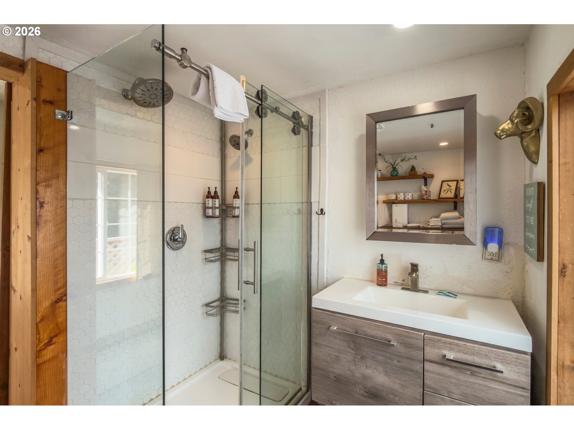 42365 Hensley Hill Road Port Orford, OR 97465 - Photo 27 of 47 a bathroom with a shower sink and mirror