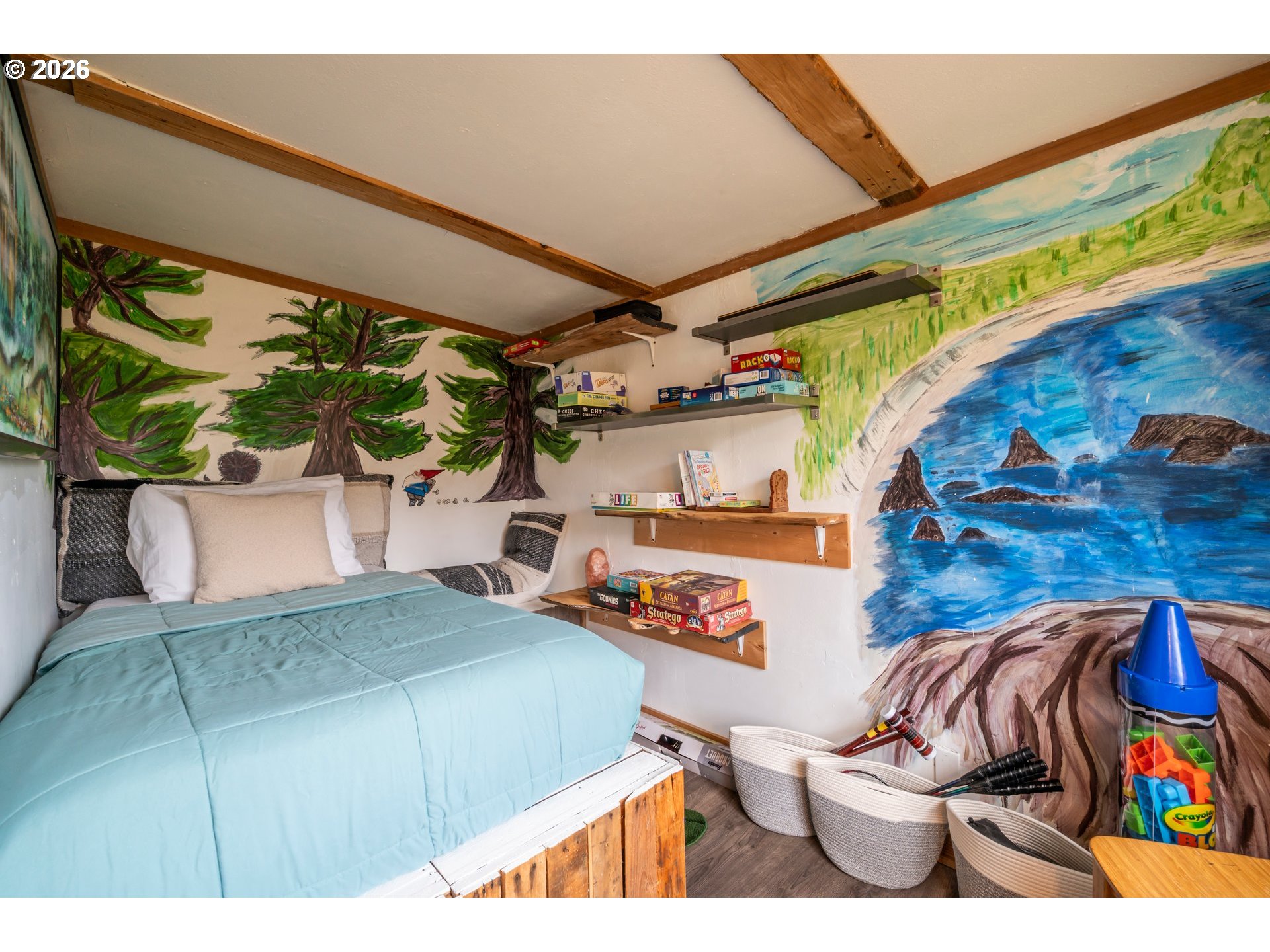 42365 Hensley Hill Road Port Orford, OR 97465 - Photo 33 of 47 a bed room with a bed and a couch