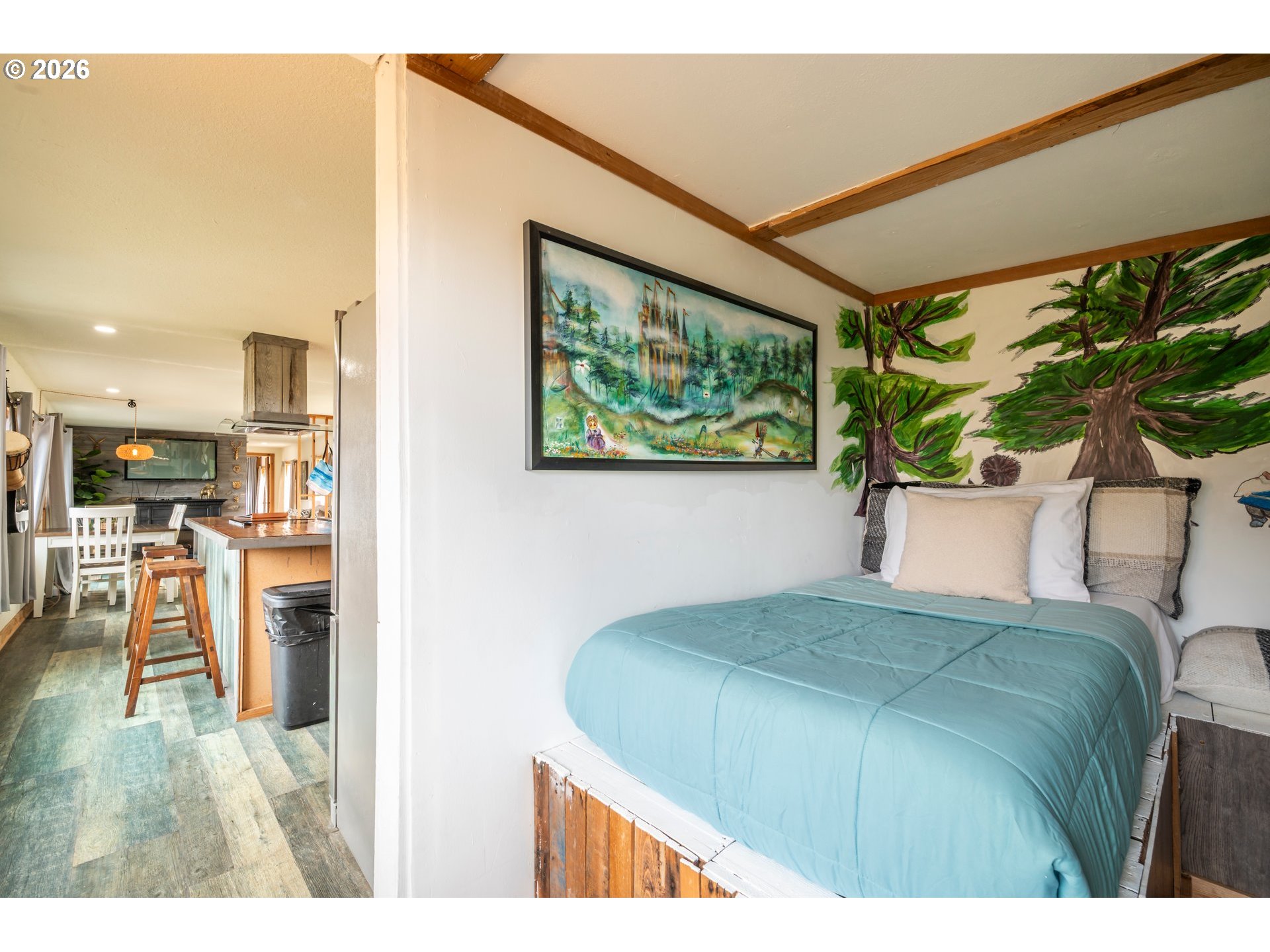 42365 Hensley Hill Road Port Orford, OR 97465 - Photo 34 of 47 a bedroom with a bed and a painting on the wall