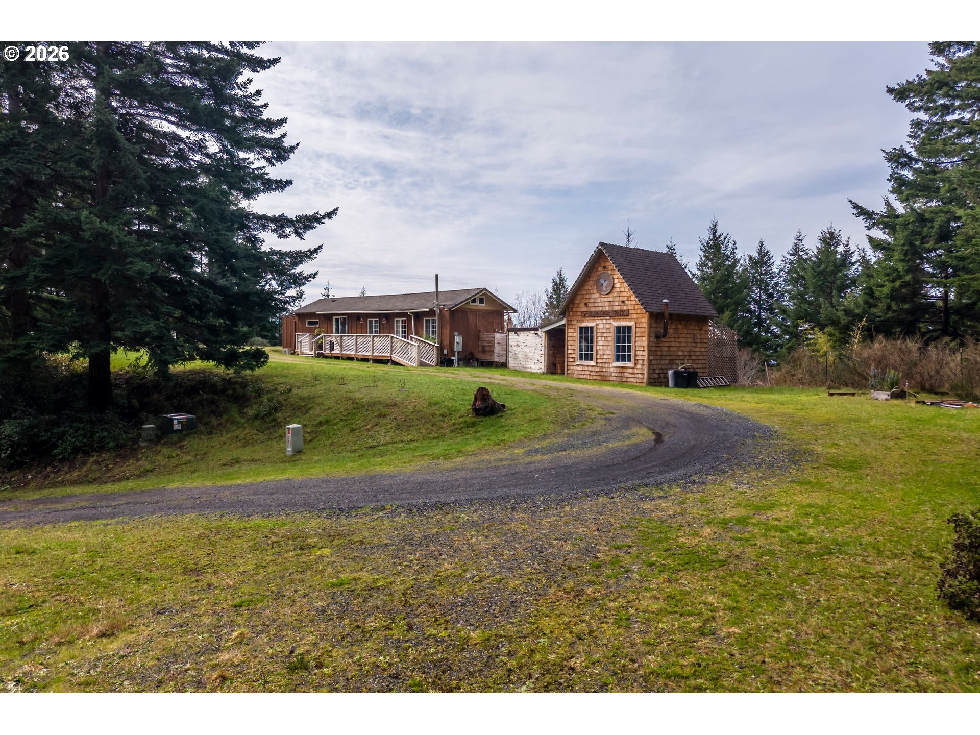 42365 Hensley Hill Road Port Orford, OR 97465 - Photo 35 of 47 a view of house with garden space and trees