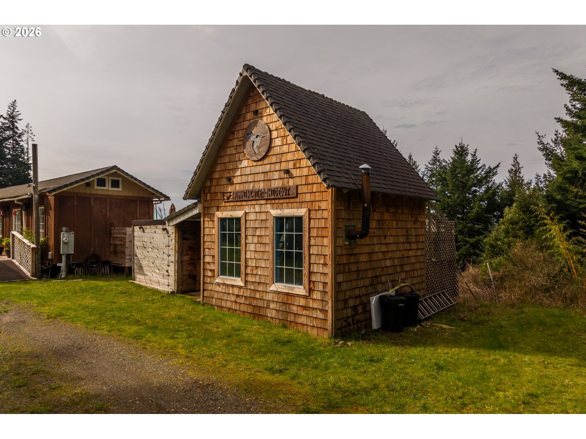 42365 Hensley Hill Road Port Orford, OR 97465 - Photo 36 of 47 a view of a house with a yard