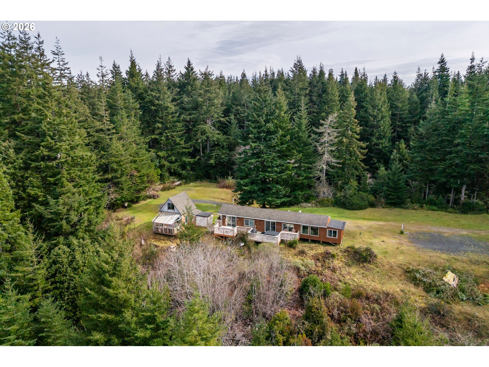 42365 Hensley Hill Road Port Orford, OR 97465 - Photo 45 of 47 a view of a lake with a city