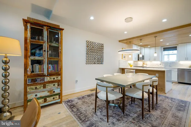 a kitchen with a table and chairs in it