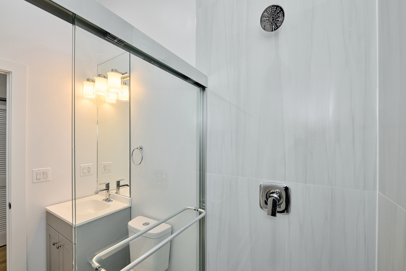 2868 West 21st Place, Unit 1 Chicago, IL 60623 - Photo 15 of 17 a bathroom with a sink and mirror with toilet