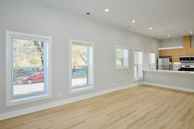 a view of a kitchen and window in the room