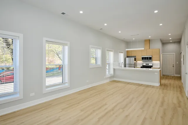 a view of kitchen with wooden floor and window