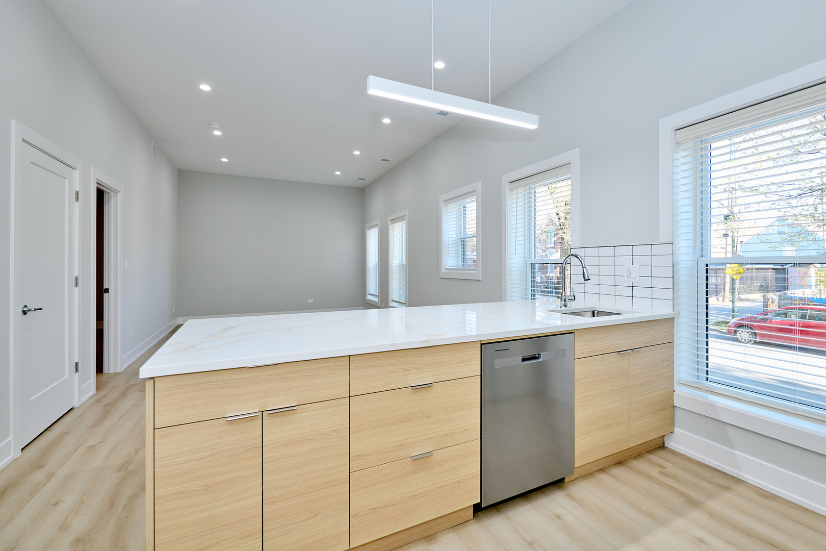 2868 West 21st Place, Unit 1 Chicago, IL 60623 - Photo 7 of 17 a spacious bathroom with a granite countertop sink a mirror and a shower
