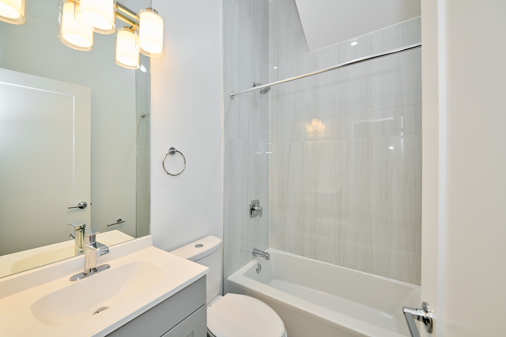 2868 West 21st Place, Unit 1 Chicago, IL 60623 - Photo 10 of 17 a bathroom with a sink toilet and shower