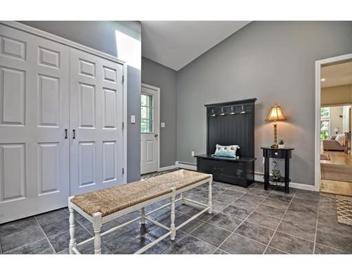 17 Deerfield Drive Medfield, MA 02052 - Photo 21 of 42 a living room with furniture a flat screen tv and a table